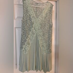 Light blue green dress with lace.